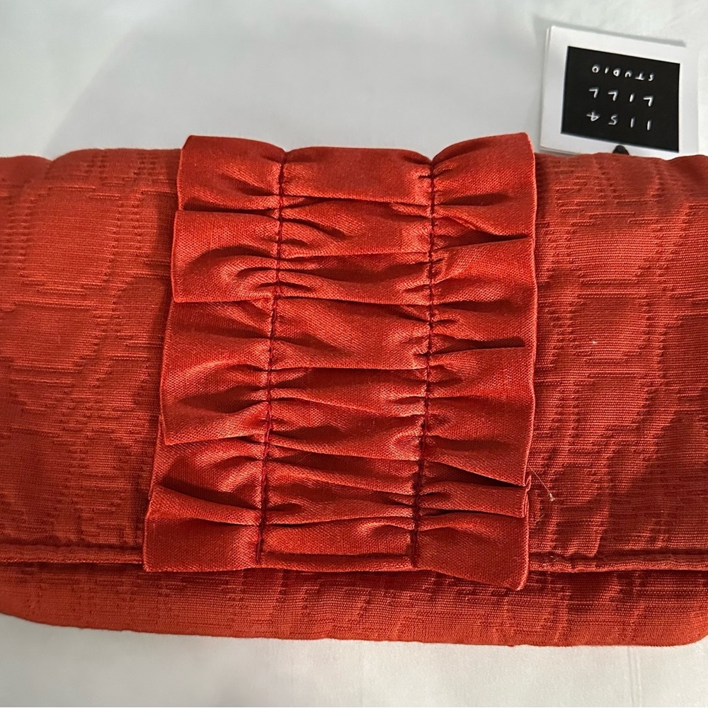Burnt Orange small clutch, brand new with tags 
1154 Lill Studio